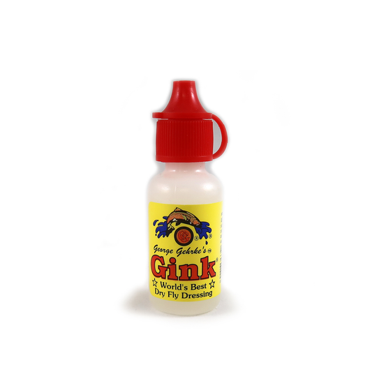 A bottle of Gehrke's Gink fly dressing with a red cap and a label featuring the product name and branding.